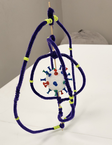Example of completed 3D atomic model showing nucleus with protons and neutrons, and electron energy levels